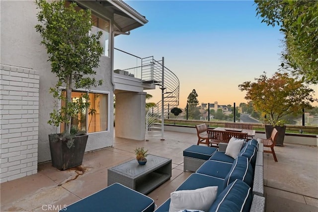 patio terrace at dusk with outdoor lounge area