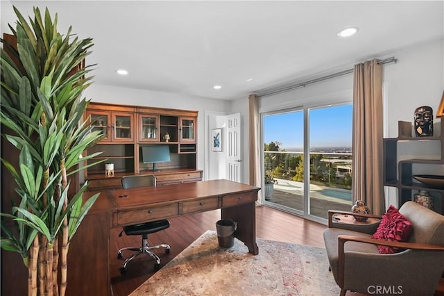 home office with wood finished floors and recessed lighting