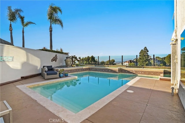 view of swimming pool featuring a patio, a fenced backyard, and a fenced in pool