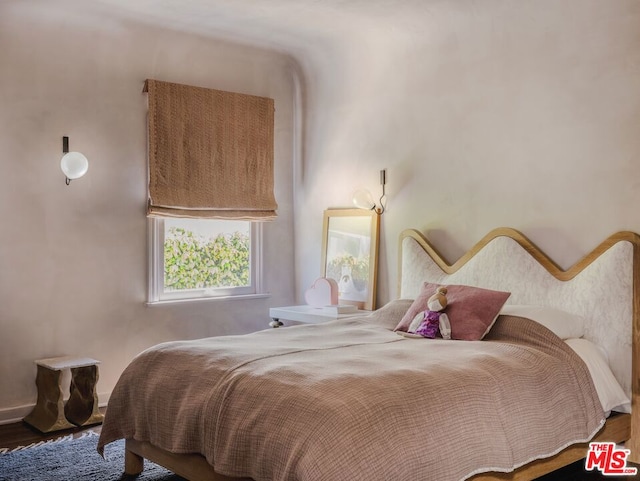 bedroom featuring hardwood / wood-style floors