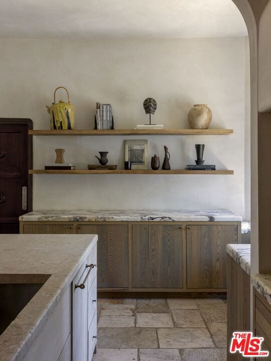 kitchen featuring light stone countertops