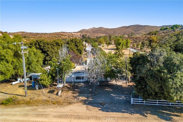 birds eye view of property with a mountain view