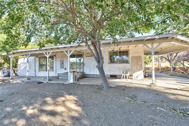 view of front of property with a carport