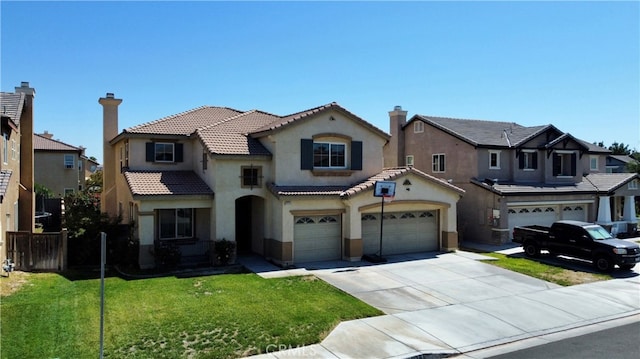 view of front of property with a garage and a front lawn