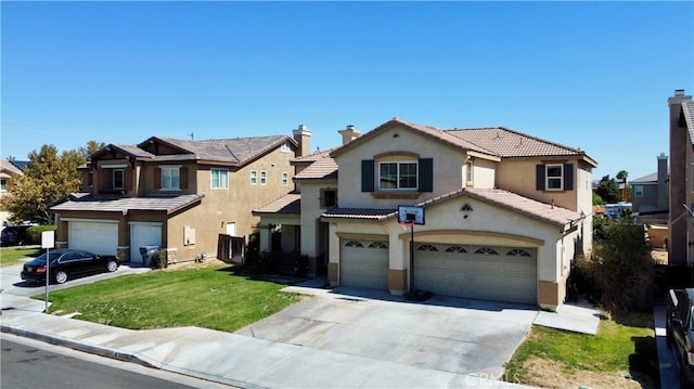 view of front of home featuring a front yard and a garage