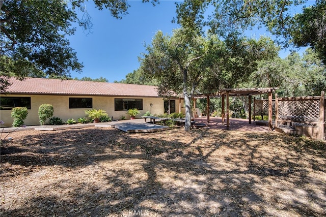 back of house with a patio and a pergola