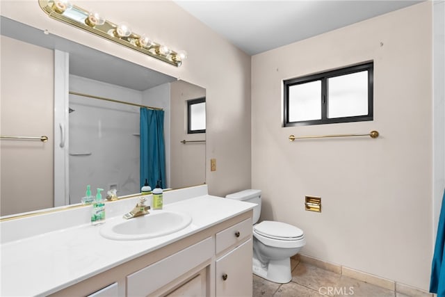 bathroom with vanity, tile patterned flooring, toilet, and curtained shower