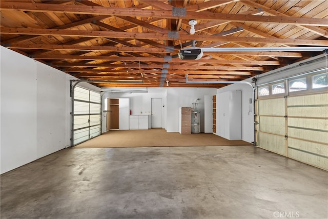 garage with wood ceiling, a garage door opener, and electric water heater