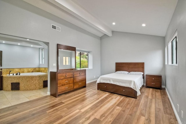 bedroom with lofted ceiling with beams and light wood-type flooring