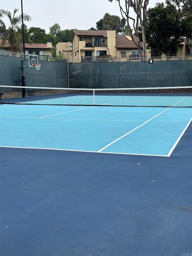 view of tennis court with basketball court