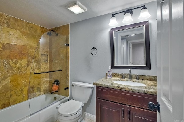 full bathroom featuring vanity, tiled shower / bath combo, and toilet