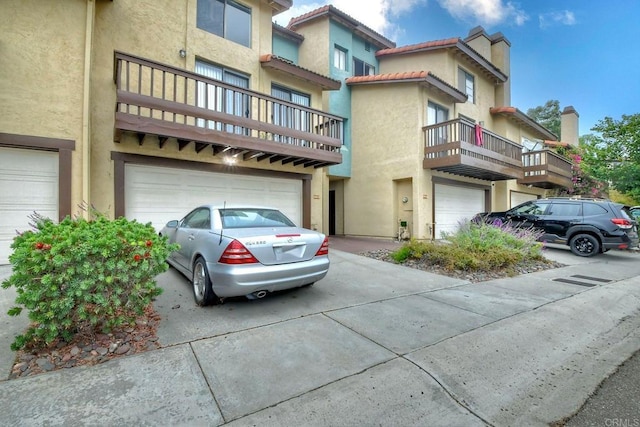 multi unit property featuring a garage