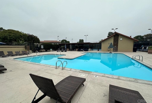 view of swimming pool featuring a patio