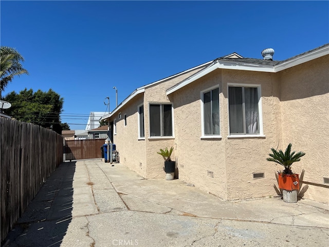 view of property exterior featuring a patio area