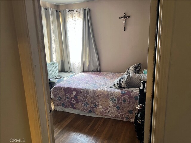 bedroom featuring hardwood / wood-style floors