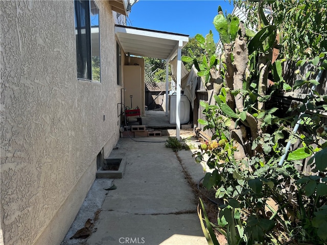 view of side of home featuring a patio