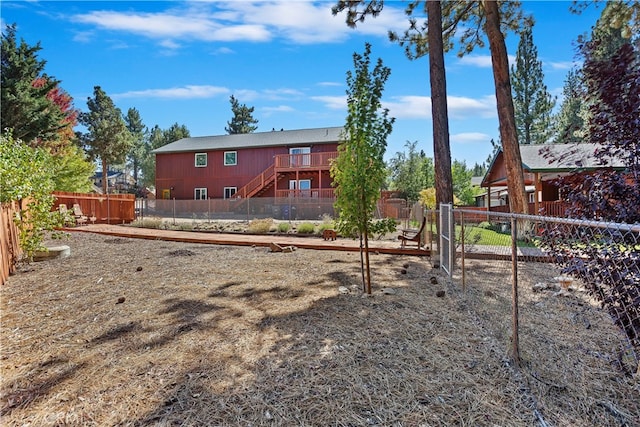 exterior space featuring a deck and a fenced backyard