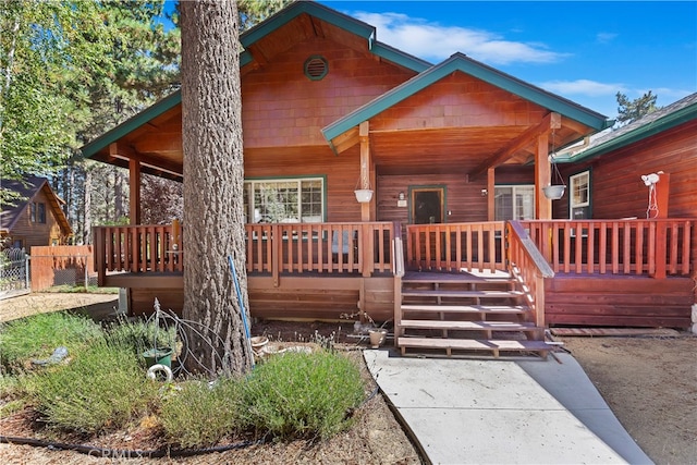 chalet / cabin featuring a porch