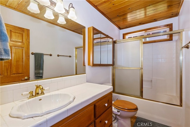 full bathroom featuring bath / shower combo with glass door, vanity, ornamental molding, wooden ceiling, and toilet