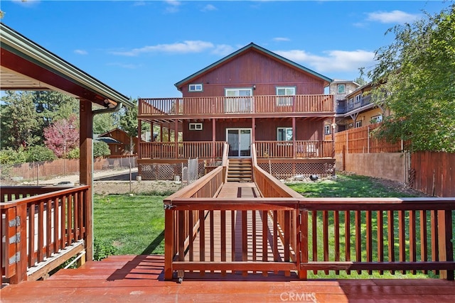 wooden deck featuring a yard