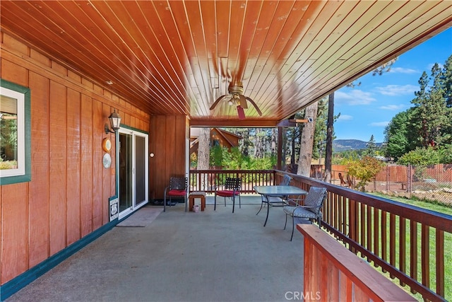 view of patio / terrace with a mountain view and ceiling fan