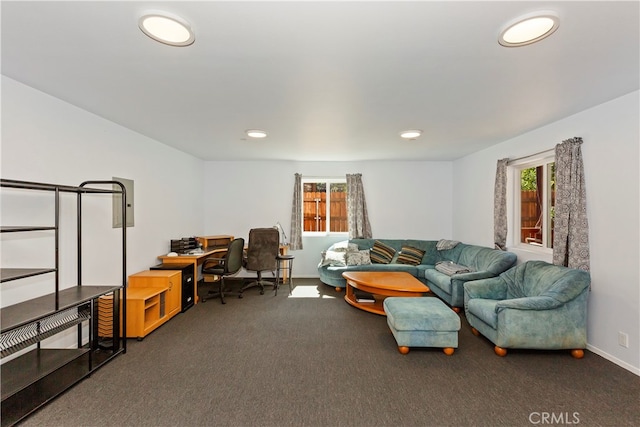 living area with a healthy amount of sunlight, recessed lighting, and carpet