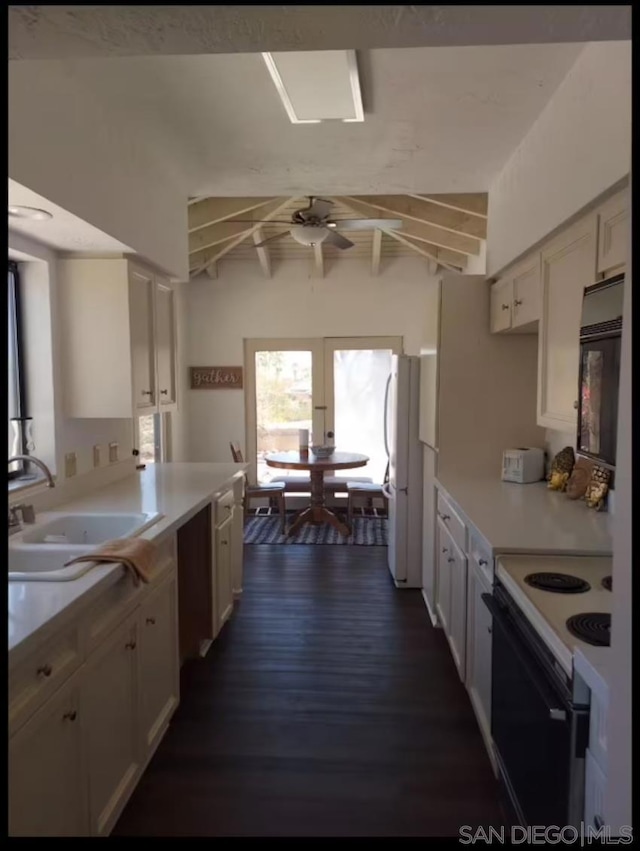 kitchen with dark hardwood / wood-style floors, sink, white cabinets, white appliances, and ceiling fan