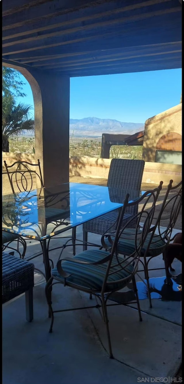 view of patio / terrace featuring a mountain view