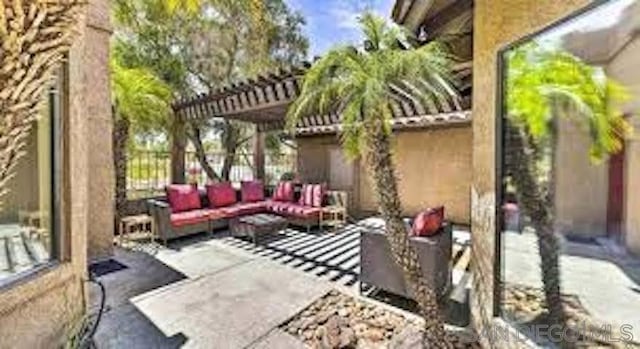 view of patio / terrace featuring outdoor lounge area and a pergola