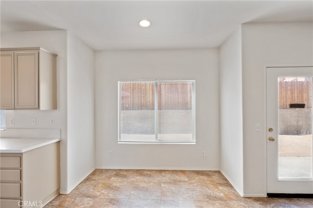 unfurnished dining area featuring a healthy amount of sunlight