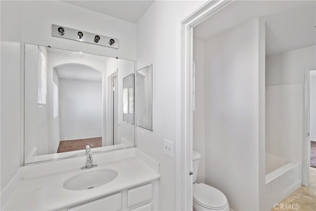 full bathroom featuring shower with separate bathtub, vanity, and toilet