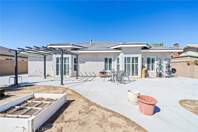 back of house featuring a patio and a pergola