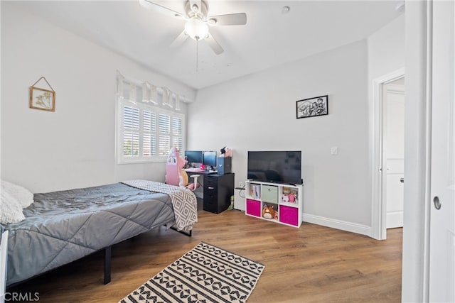 bedroom featuring ceiling fan and hardwood / wood-style floors