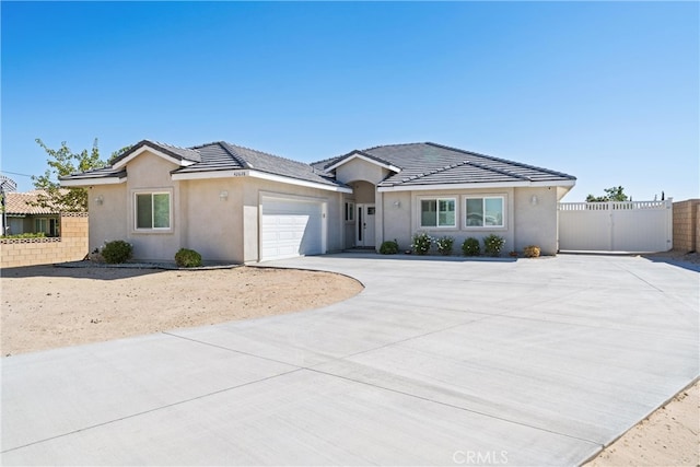 ranch-style house featuring a garage