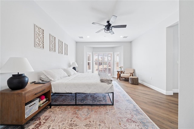 bedroom featuring ceiling fan and hardwood / wood-style flooring