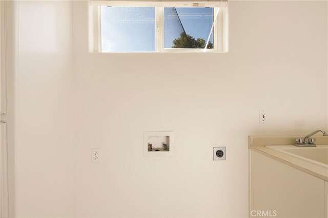 clothes washing area featuring hookup for a washing machine and electric dryer hookup