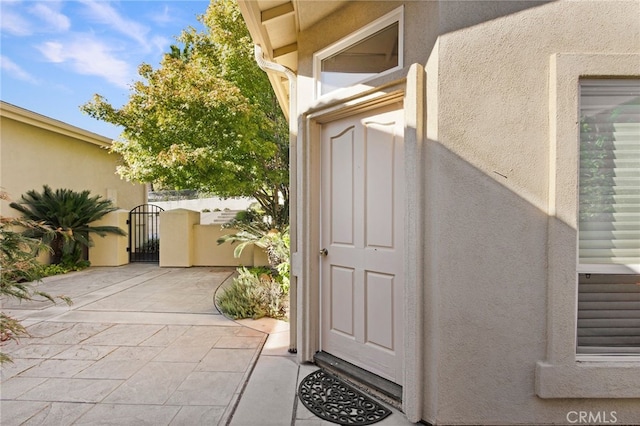 3185 Via Casita Pl, Chico, CA 95928 - view of exterior entry featuring a gate and stucco siding