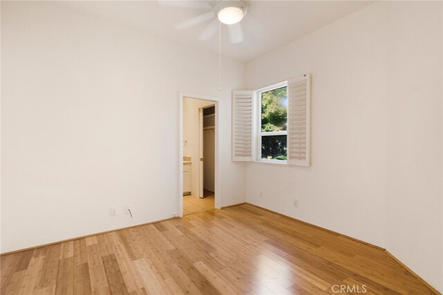 unfurnished room with ceiling fan and light hardwood / wood-style flooring