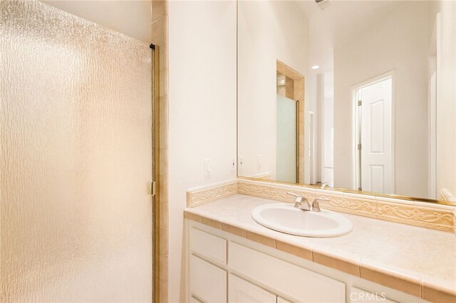 bathroom with vanity and an enclosed shower