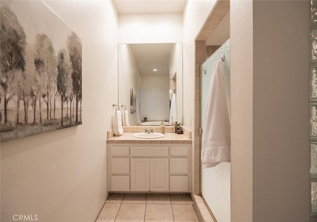 3185 Via Casita Pl, Chico, CA 95928 - full bathroom with tile patterned flooring, vanity, a shower, and a textured wall