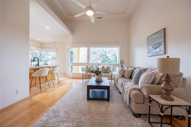 3185 Via Casita Pl, Chico, CA 95928 - living room with a ceiling fan, light wood-style floors, and a high ceiling