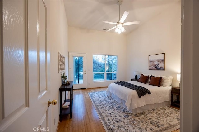 3185 Via Casita Pl, Chico, CA 95928 - bedroom featuring hardwood / wood-style floors, access to exterior, high vaulted ceiling, and ceiling fan