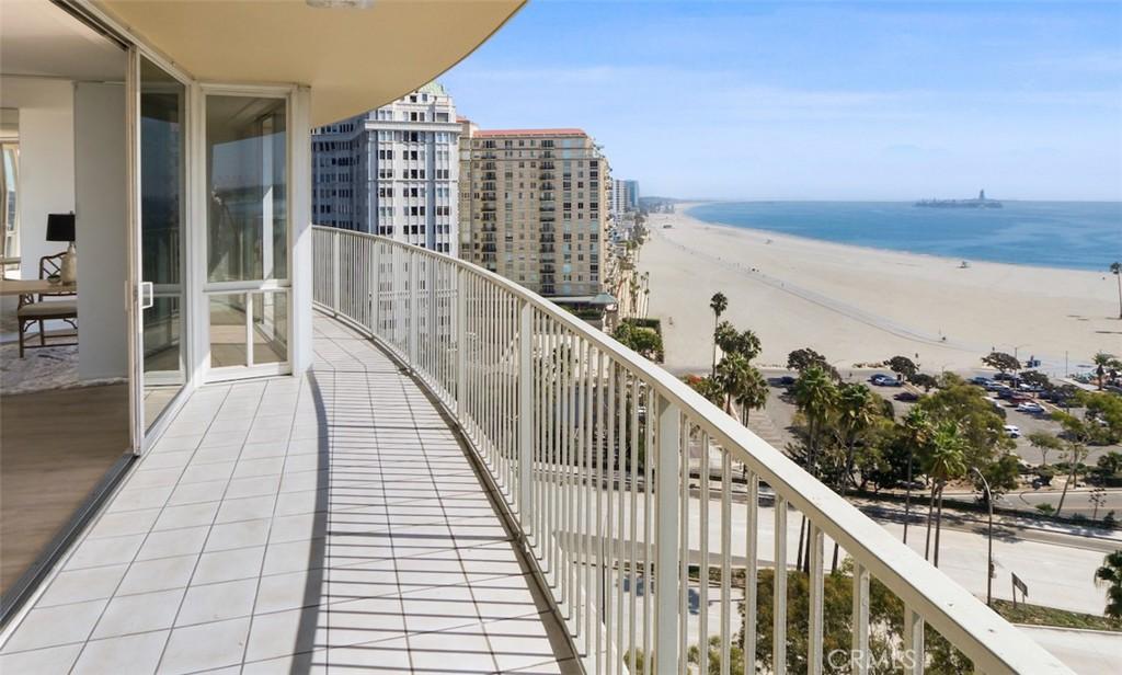 balcony with a beach view and a water view