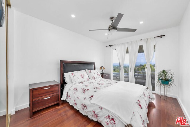 bedroom with ceiling fan, dark hardwood / wood-style floors, and access to exterior