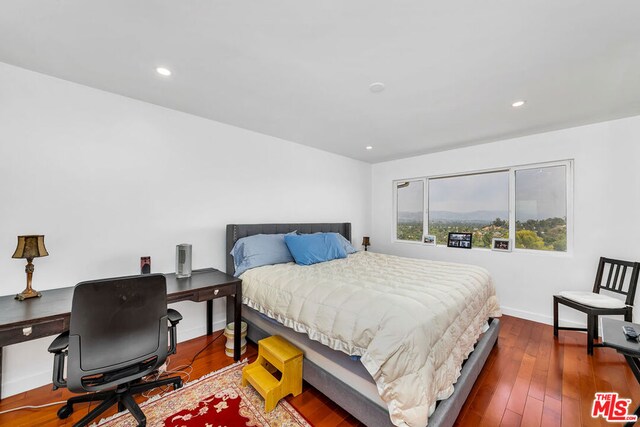 bedroom featuring dark hardwood / wood-style floors