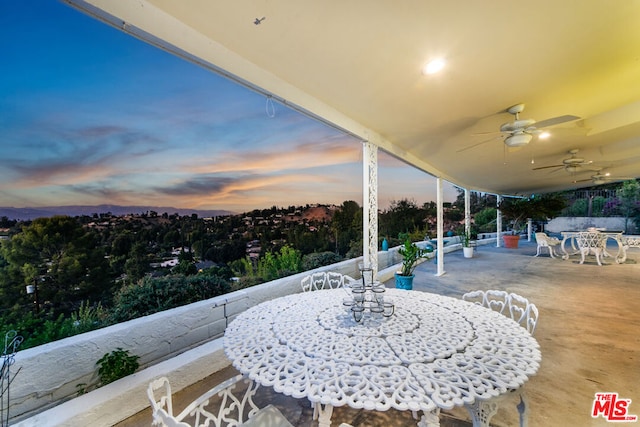 patio terrace at dusk with ceiling fan