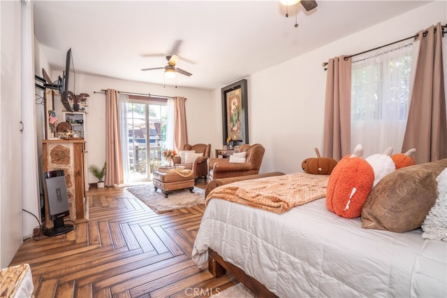 bedroom featuring parquet floors, ceiling fan, and access to exterior