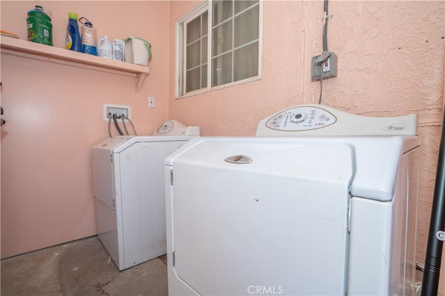 laundry room with washing machine and clothes dryer