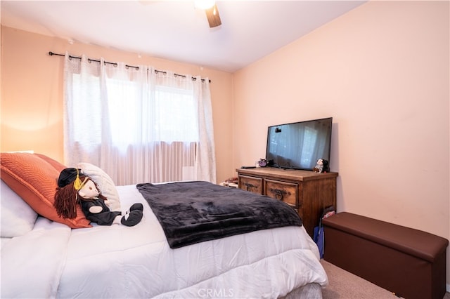 bedroom featuring ceiling fan and carpet