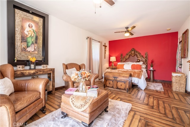 bedroom with ceiling fan and parquet floors